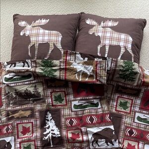 Moose throw pillows and rustic cabin themed shams